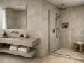 Salle de bain moderne avec lavabo suspendu, douche à l'italienne et **béton ciré sol** pour une ambiance épurée.