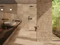 Salle de bain luxueuse avec carrelage en travertin. Le travertin, c'est quoi ? Une pierre naturelle chaleureuse et texturée.