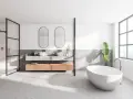 Salle de bain moderne avec baignoire îlot, double vasque et douche. Le sol en béton ciré, un carrelage sans joint, crée une ambiance épurée et contemporaine.
