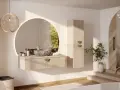 Une salle de bain épurée avec une vasque en pierre, un miroir rond et une touche de verdure. Une **déco salle de bain nature** apaisante.