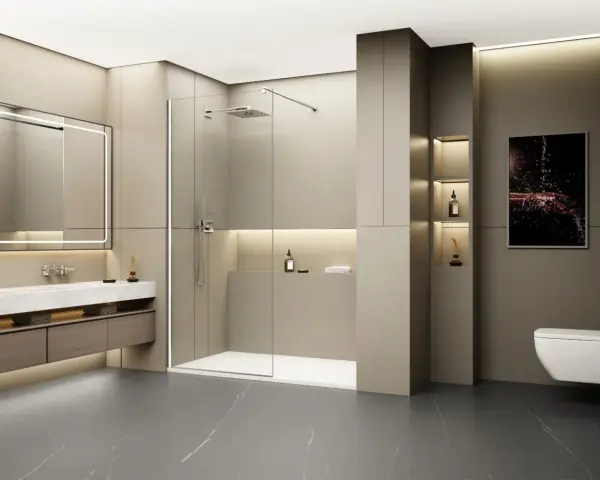 Salle de bain moderne avec un grand miroir lumineux, un lavabo suspendu et une douche à l'italienne. Le ressaut douche est discret, intégré au design épuré.