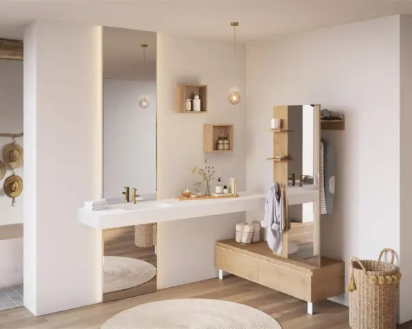 Salle de bain ouverte sur chambre, avec baignoire, lavabo, miroir, et mobilier en bois. Ambiance épurée et naturelle.