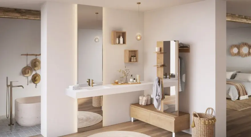 Salle de bain ouverte sur chambre, avec baignoire, lavabo, miroir, et mobilier en bois. Ambiance épurée et naturelle.